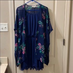Blue dress with sleeved floral drape